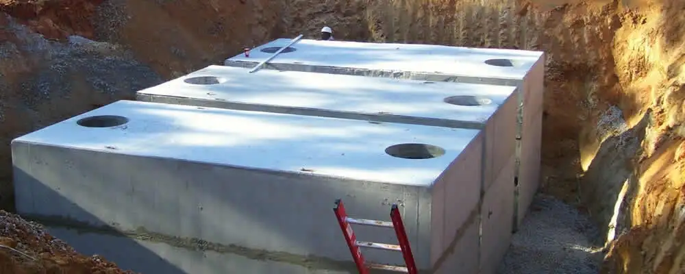 Septic tank installation site with a newly placed concrete tank in Lakeland, FL